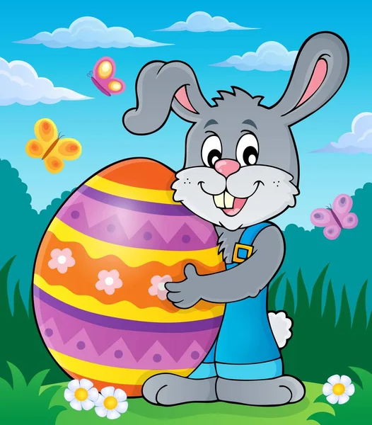 Кролик держит большое пасхальное яйцо тема 2 — стоковый вектор