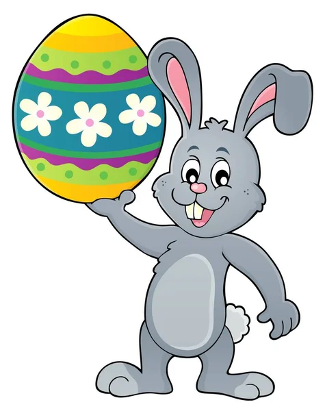 Królik trzymając wielki Easter egg temat 1 — Wektor stockowy