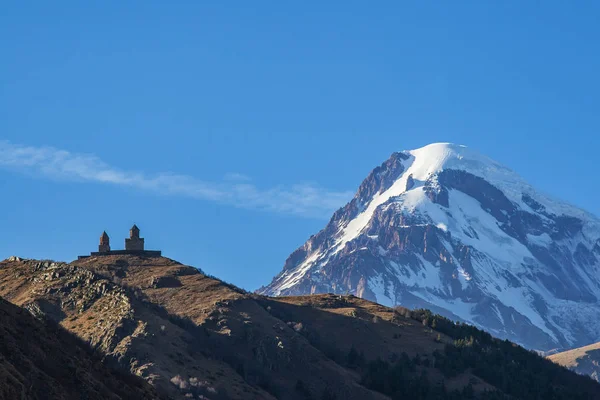 Holy Trinity Church near the village of Gergeti in Georgia