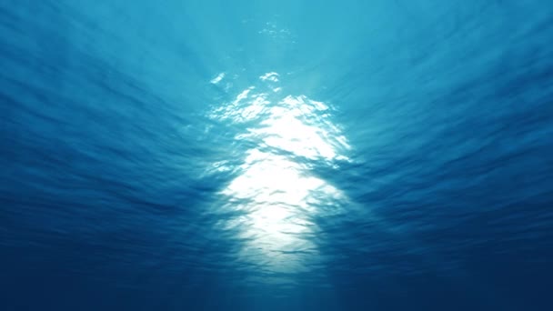 Luce subacquea, raggi solari che brillano attraverso la superficie dell'oceano — Video Stock