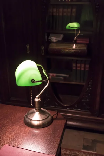 Classical lamp on the desk in old stylish office. — Stock Photo, Image