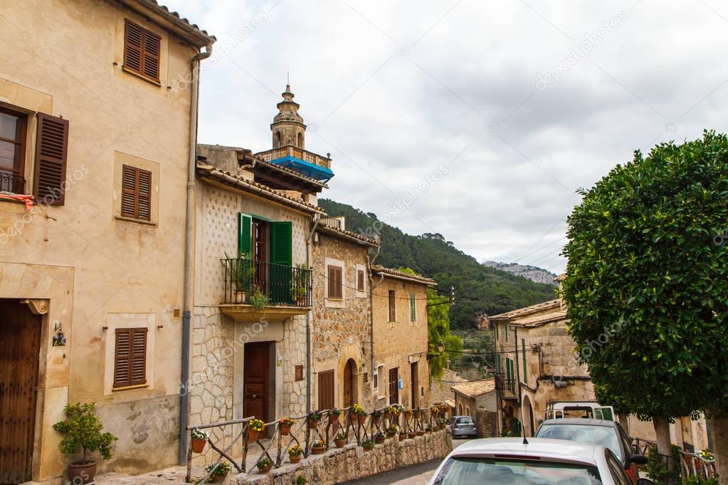 Street and facades of houses in Valldemossa, Mallorca side view. Spain