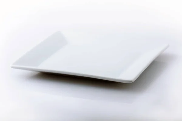 Placa branca no fundo branco — Fotografia de Stock