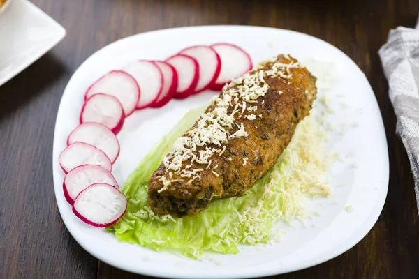 Pork roulades stuffed with spinach sprinkled with freshly grated — Stock Photo, Image