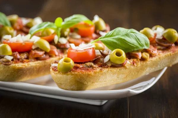 Mini pizza and casseroles — Stock Photo, Image