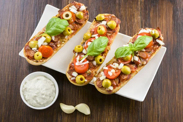 Mini pizza and casseroles — Stock Photo, Image