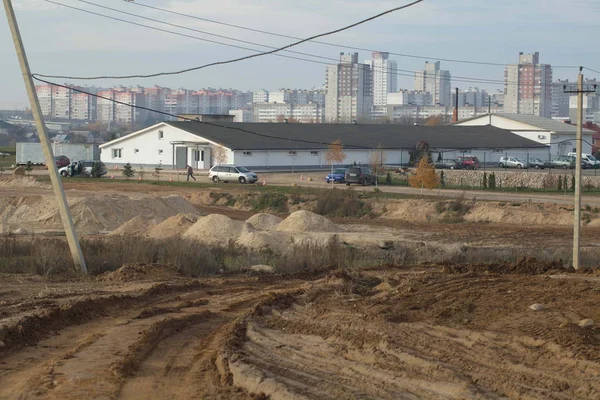 Maquinaria para la construcción de carreteras en el nuevo distrito —  Fotos de Stock