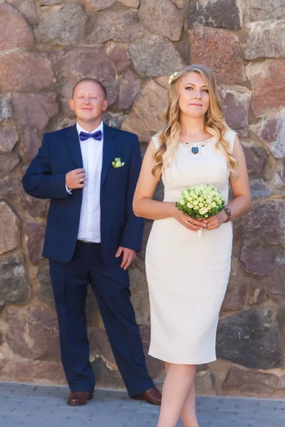 Happy newlyweds near bride and groom — Stock Photo, Image