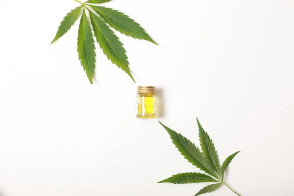 Cannabis leaves CBD oil hemp products — Stock Photo, Image