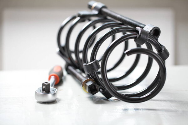 repair of the suspension car. replacing shock absorber spring