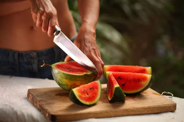 Women Cutting Fresh Ripe Watermelon Pieces Knife Wooden Table — Stock Photo, Image