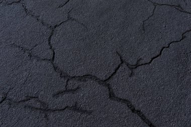 Old destroyed asphalt with cracks clipart