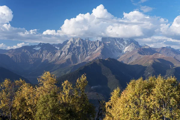 Autumn Landscape with birch forest and mountain peak Ushba — Stock Photo, Image