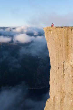 Girl on the Rock Preikestolen, Norway clipart