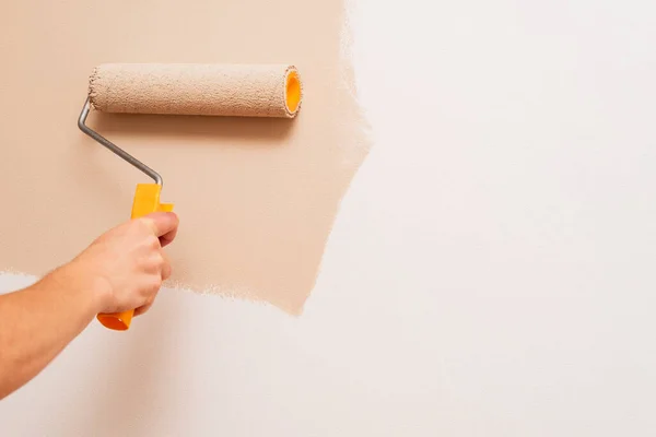 Paint the walls with a roller — Stok fotoğraf