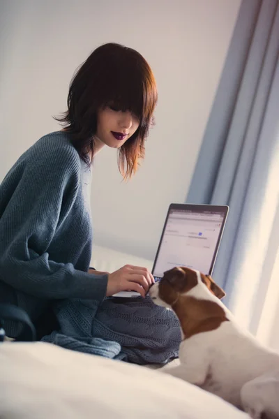 woman with dog and notebook