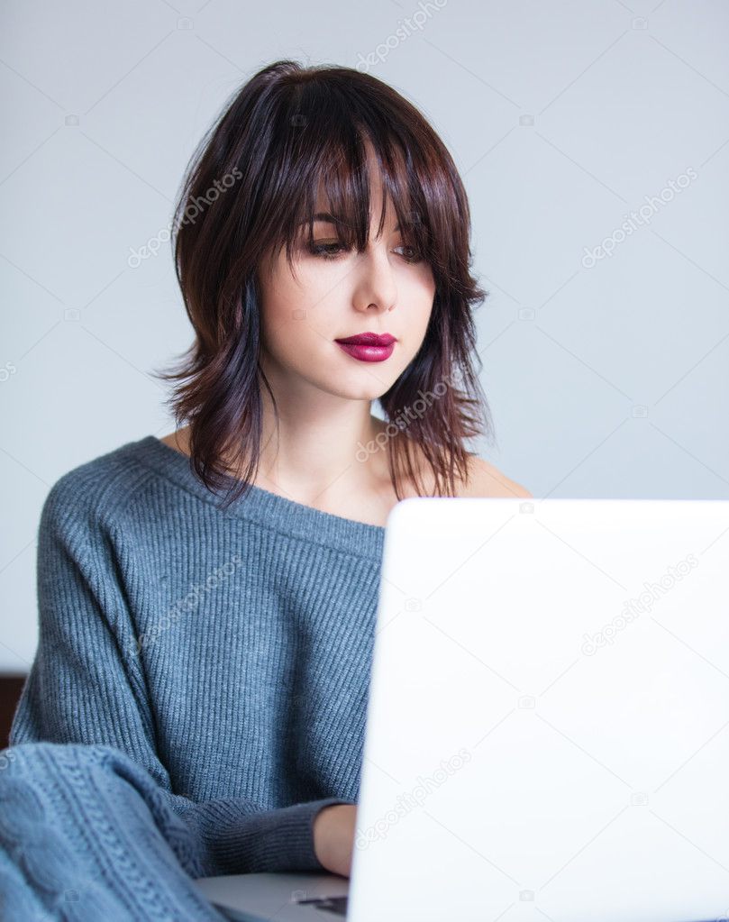 woman with notebook working at home