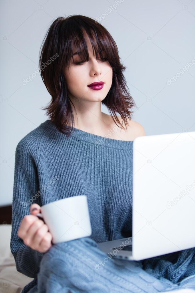woman with of coffee or tea and notebook
