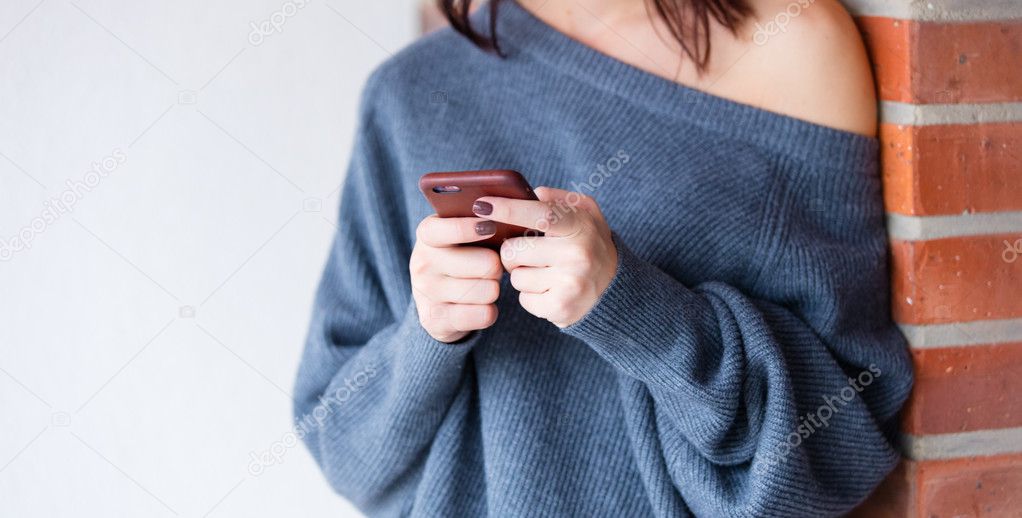 young caucasian woman with mobile phone 