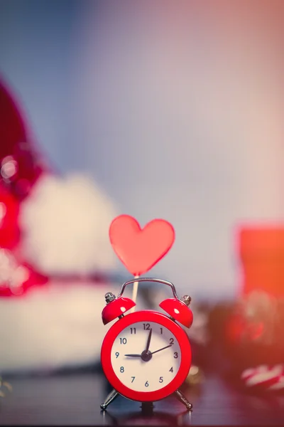 Alarm clock and christmas decorations — Stock Photo, Image