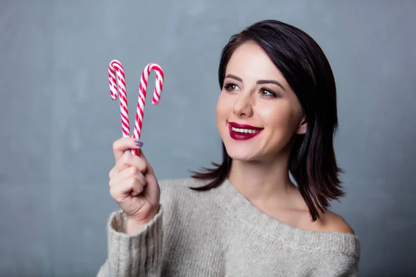Woman with christmas lollipop — Stock Photo, Image