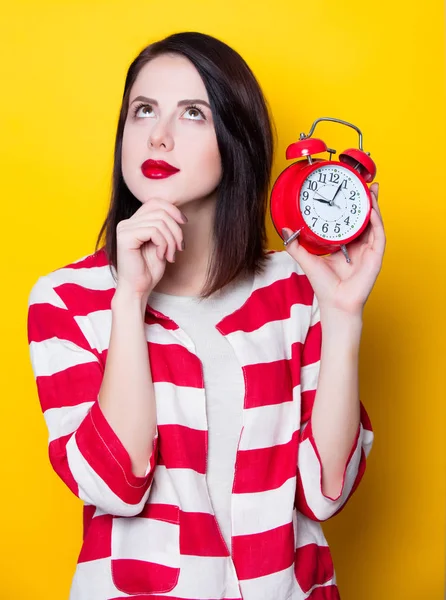 Brown hair girl with alarm clock — Stock Photo, Image