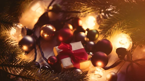 Christmas gift and fairy lights — Stock Photo, Image