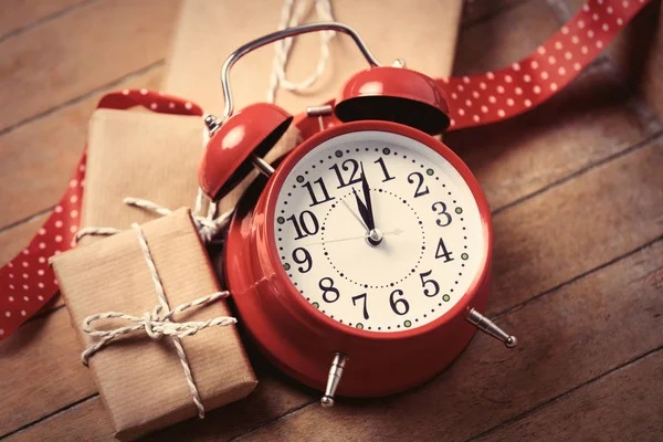 Gifts, ribbon and clock — Stock Photo, Image