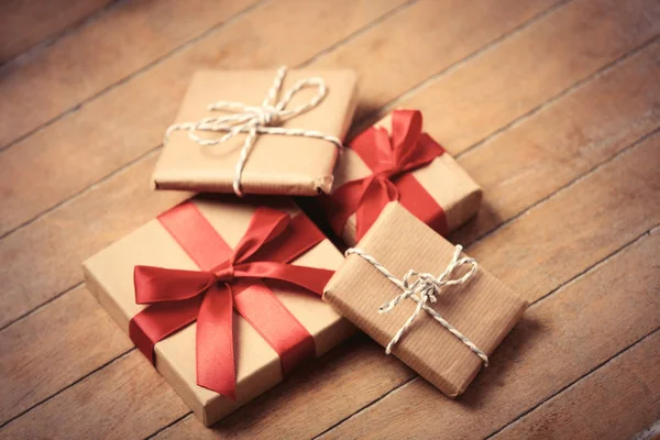 Beautiful gifts on wooden table — Stock Photo, Image