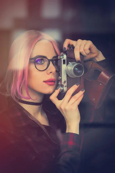 Young woman with camera — Stock Photo, Image