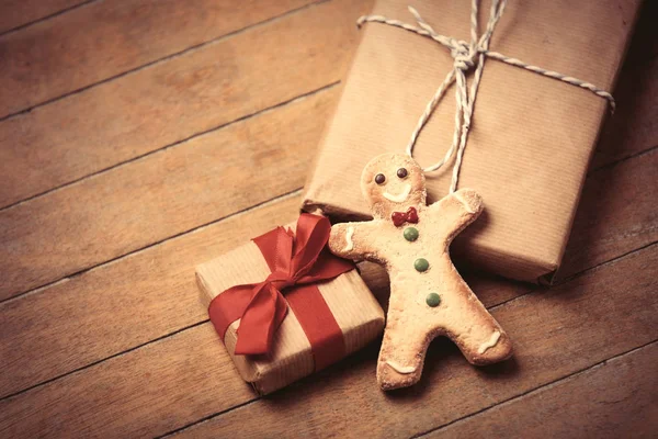 Gifts and gingerbread man — Stock Photo, Image