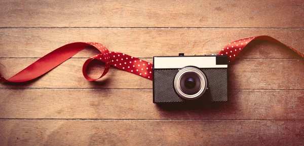 Camera and ribbon — Stock Photo, Image