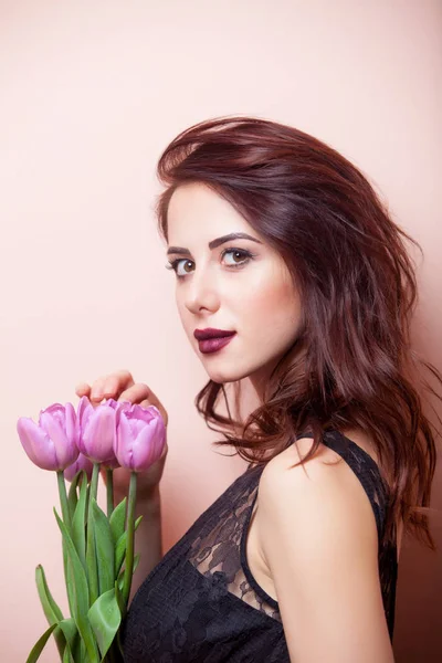 Beautiful woman with tulips — Stock Photo, Image