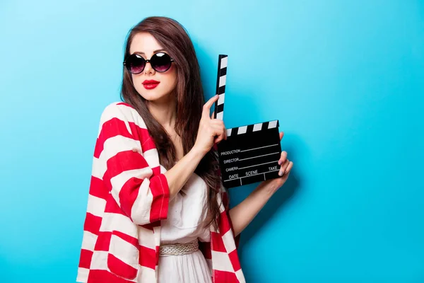 Woman with cinema clapper — Stock Photo, Image
