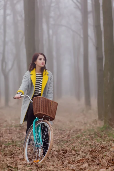 Woman sitting on bicycle — Stock Photo, Image