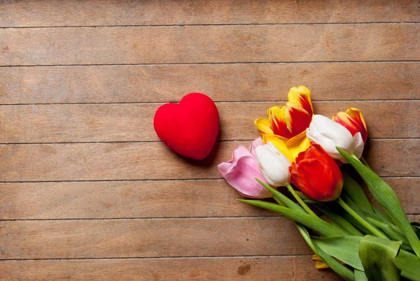 Tulips and heart shaped toy — Stock Photo, Image