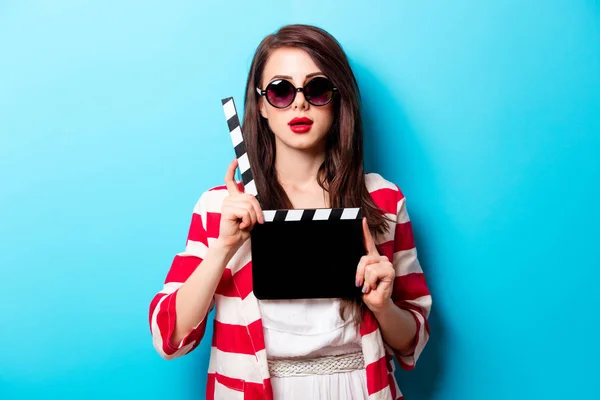 Woman with cinema clapper — Stock Photo, Image