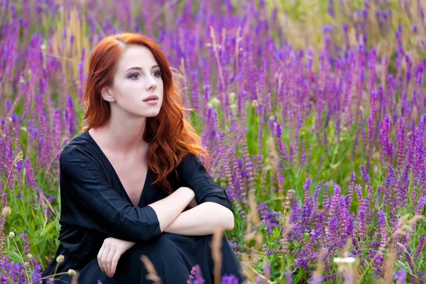 Beautiful young woman sitting — Stock Photo, Image