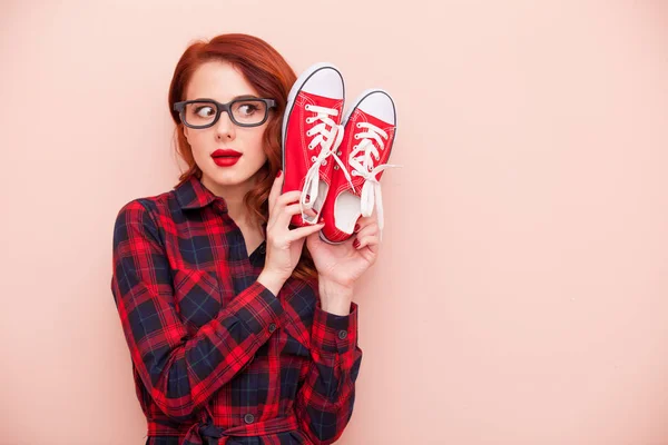 Woman with red gumshoes — Stock Photo, Image