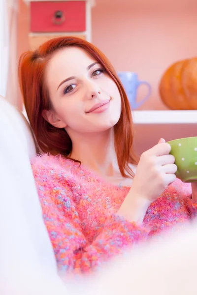 Photo of beautiful young woman with cup of coffee relaxing on th — Stock Photo, Image