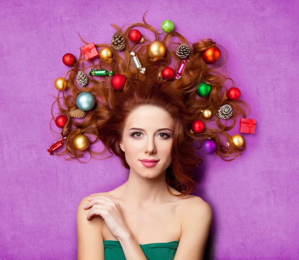 Beautiful young woman with gifts — Stock Photo, Image