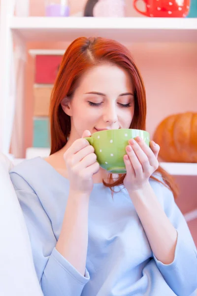 Photo of beautiful young woman drinking her fresh coffee and rel — Stock Photo, Image
