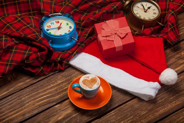 Cup of coffee, santa claus hat — Stock Photo, Image