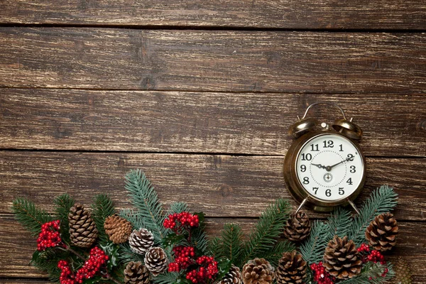 Alarm clock near beautiful christmas decorations — Stock Photo, Image