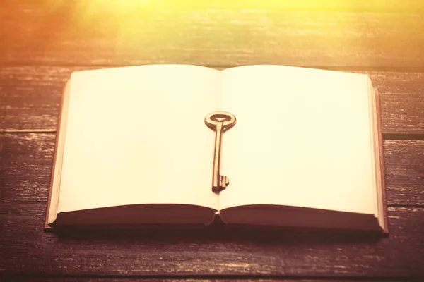 Cool empty notebook and key — Stock Photo, Image