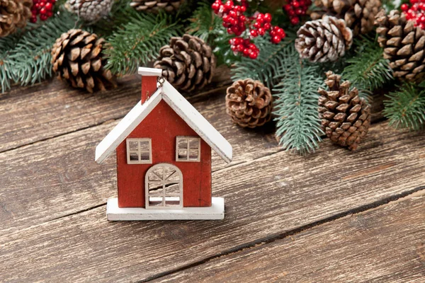 House shaped toy near christmas decorations — Stock Photo, Image