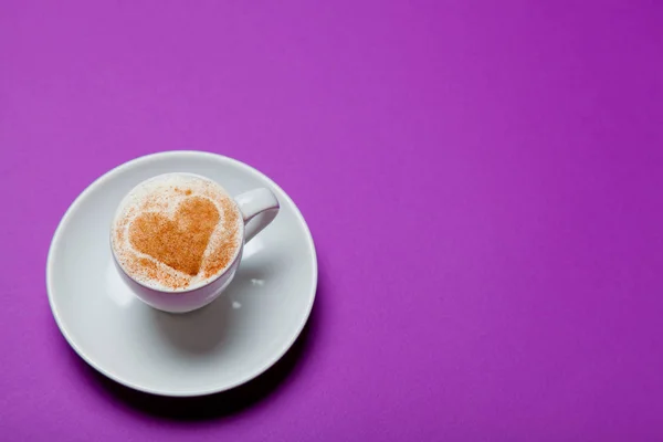 Cup of coffee on the purple background — Stock Photo, Image