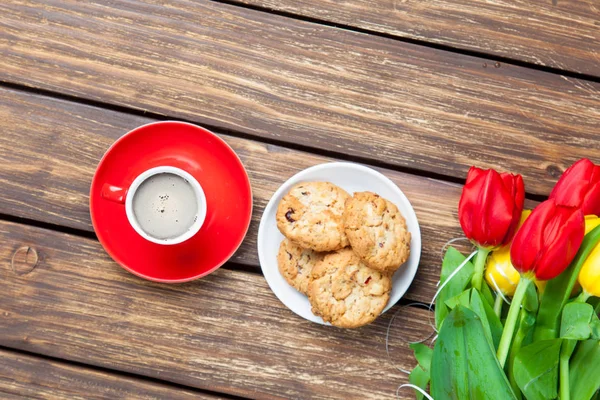 Plate full of cookies and cup of coffee — Stock Photo, Image