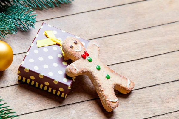 Gingerbread man and fir tree branch — Stock Photo, Image