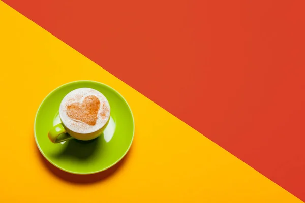 Cup of coffee on the colorful background — Stock Photo, Image